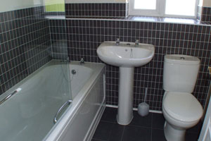 Example of furnished black bathroom